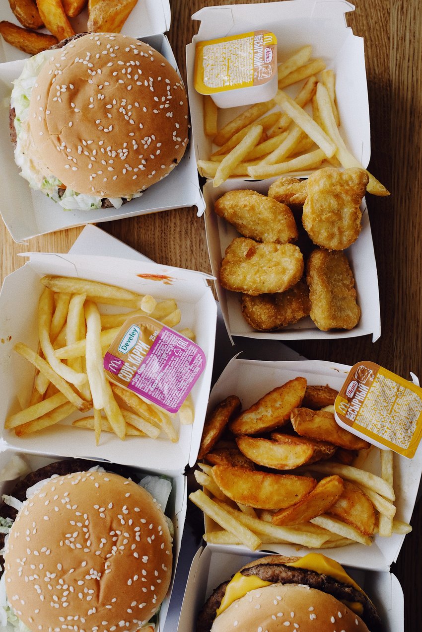 Tasty junk food on wooden table